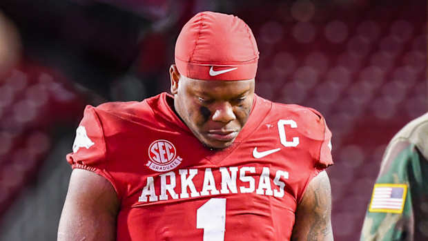 Razorbacks quarterback KJ Jefferson walks off field after loss to Auburn